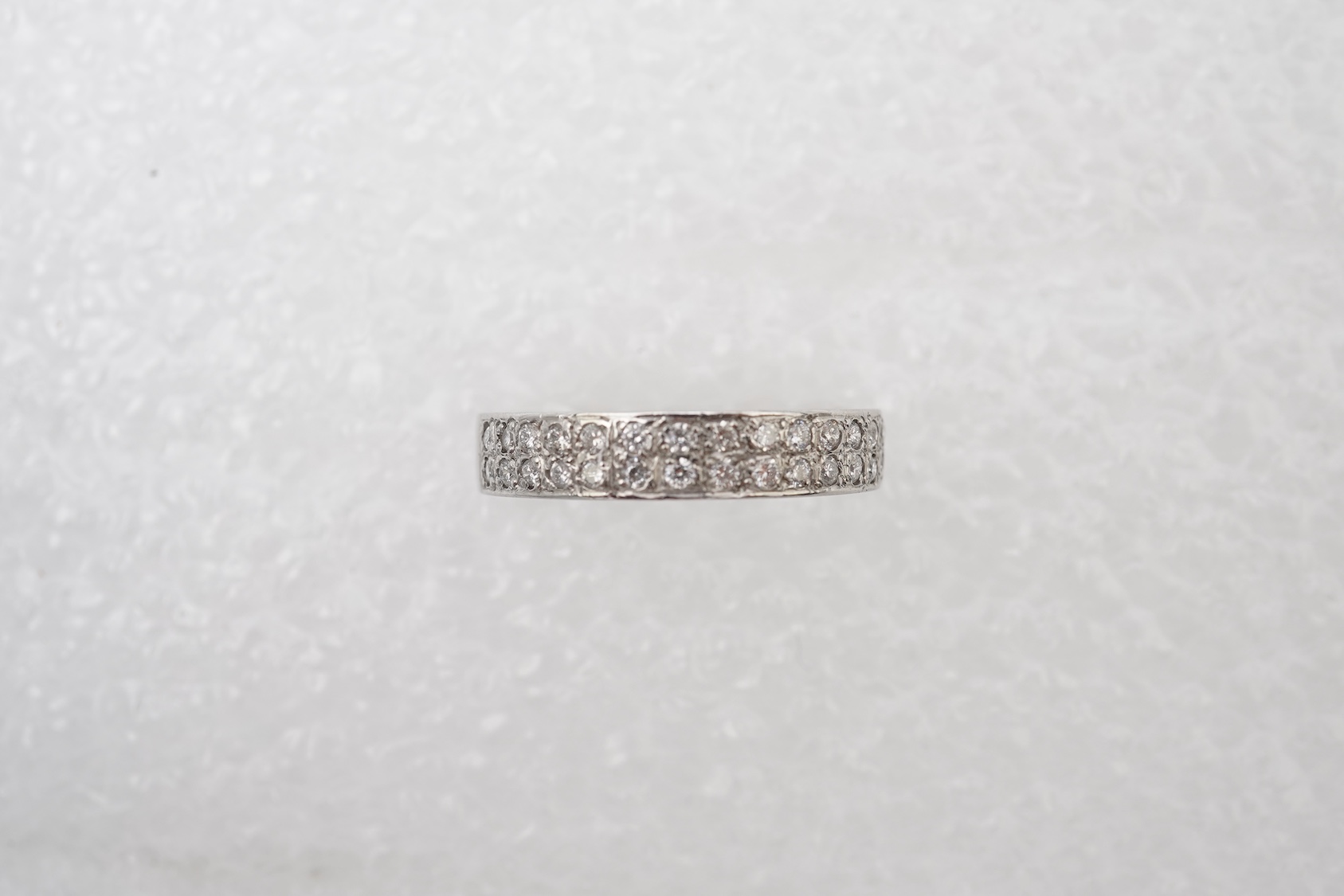 A diamond half eternity ring